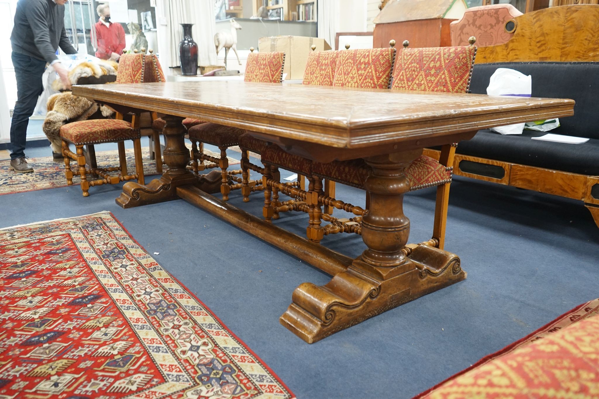 An 18th century style rectangular walnut refectory dining table on baluster end supports with central stretcher, length 270cm, width 106cm, height 76cm